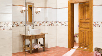 RAKO | Koupelna s lehce taženým stěrkovaným reliéfem. Květinová dekorace ve vícebarevném odstínu. 