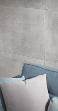 RAKO | Imitace industriálního betonu s charakteristickým rámováním v šedé barvě.
