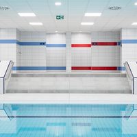 RAKO | Sociální zázemí pro muže a ženy v bazénu v Bratislavě. Prostor pro muže tvořen do modré barvy, zatímco prostor pro ženy v červeném odstínu.